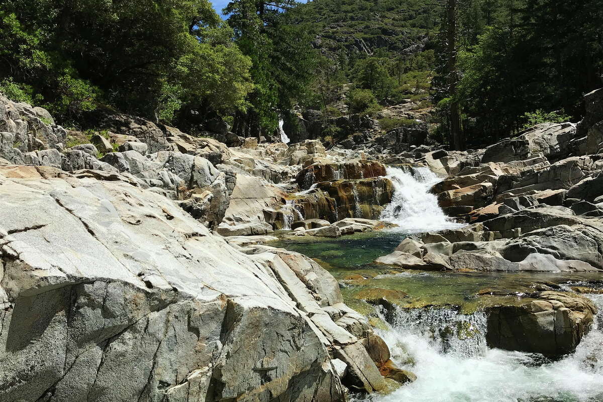 FILE: The North Fork coursing through granite pools below Palisade Falls, which is visible at upper center, is part of the Palisades Creek Trail in Placer County.