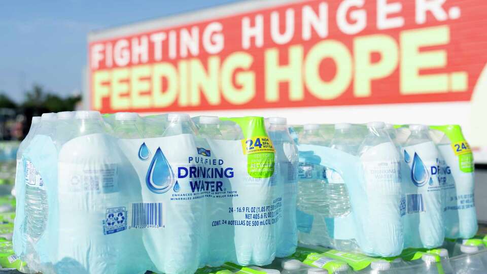 Bottles of water are seen before they’re distrusted to 1,500 Montgomery County residents at Woodforest Bank Stadium after Hurricane Beryl made its way through the Greater Houston area, Wednesday, July 10, 2024, in Shenandoah.