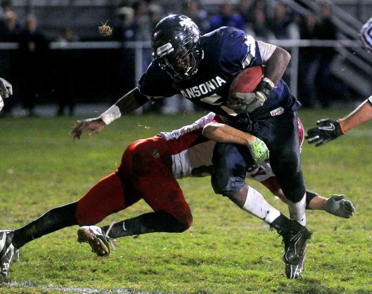 Ansonia's Montrell Dobbs is tackled during Friday's game at Jarvis Field in Ansonia on October 29, 2010.