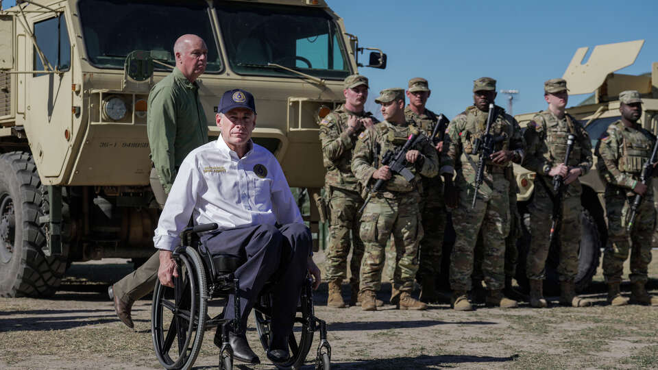 National Guard stands behind Texas Gov. Greg Abbott and fellow Governors as they hold a press conference along the Rio Grande at the U.S.-Mexico border to discuss Operation Lone Star and border concerns on Sunday, February 4, 2024 in Eagle Pass, TX.