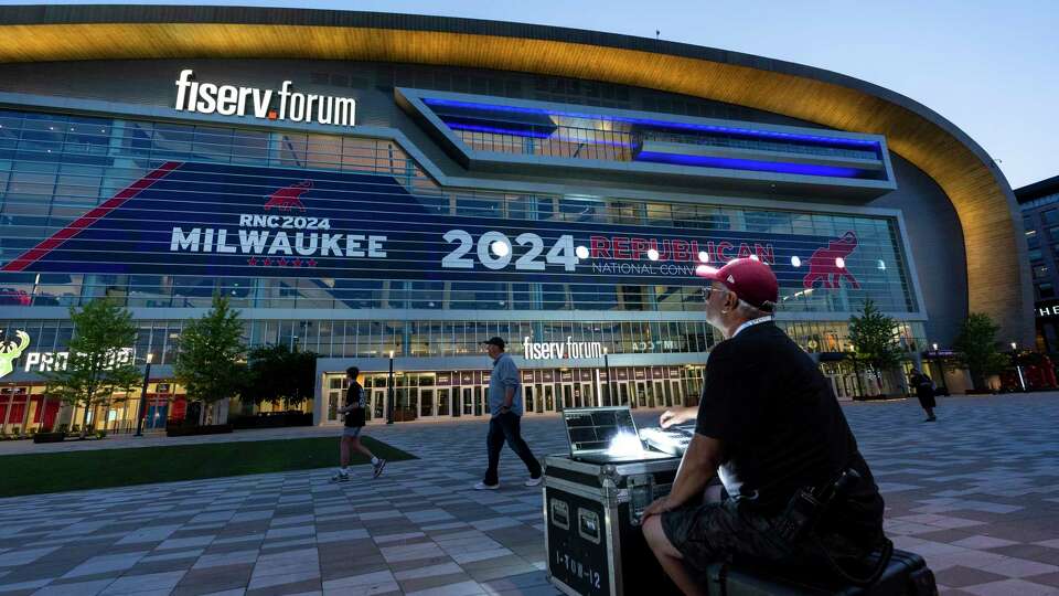 Darrin Bruce works on the exterior lighting on the Fiserv Forum ahead of the 2024 Republican National Convention, Thursday, July 11, 2024, in Milwaukee.