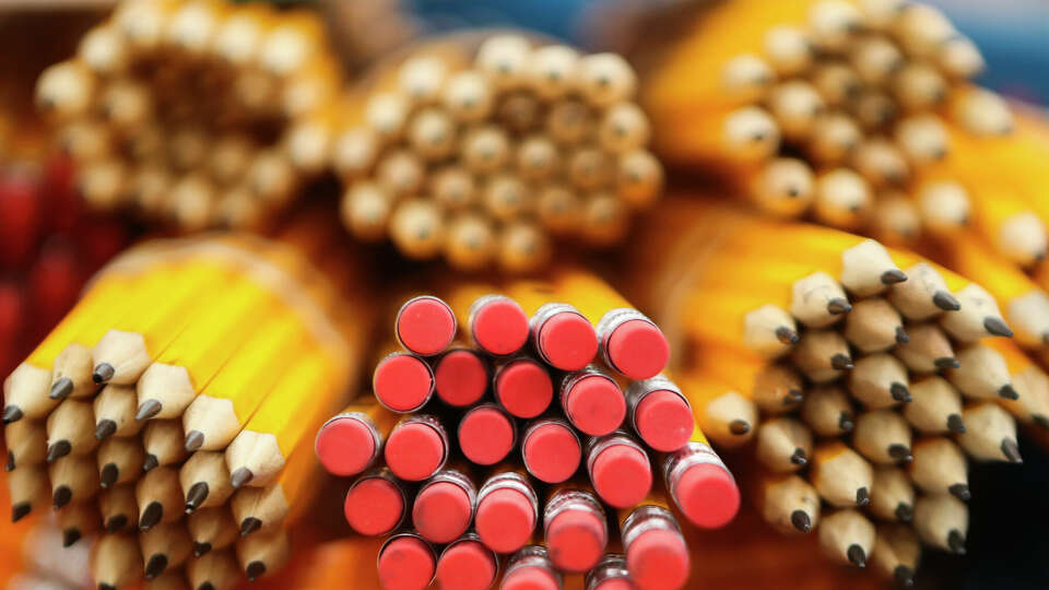 Yellow No. 2 pencils are seen as volunteers pack more than 1,500 backpacks with school supplies at Bradley Elementary School, Saturday, Aug. 5, 2023, in Spring. The annual effort helps provide supplies to students in 13 Conroe ISD schools.