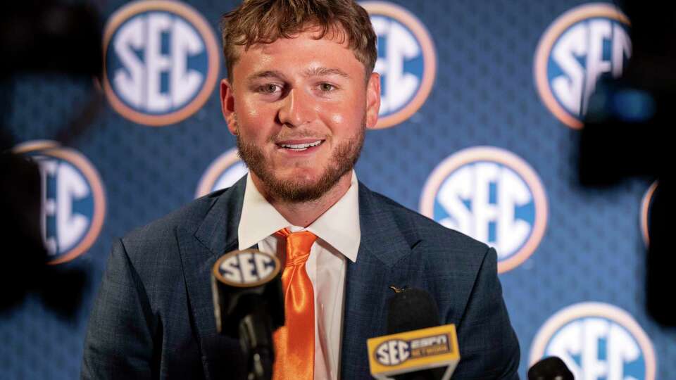 Texas quarterback Quinn Ewers speaks during the Southeastern Conference NCAA college football media days Wednesday, July 17, 2024, in Dallas. (AP Photo/Jeffrey McWhorter)