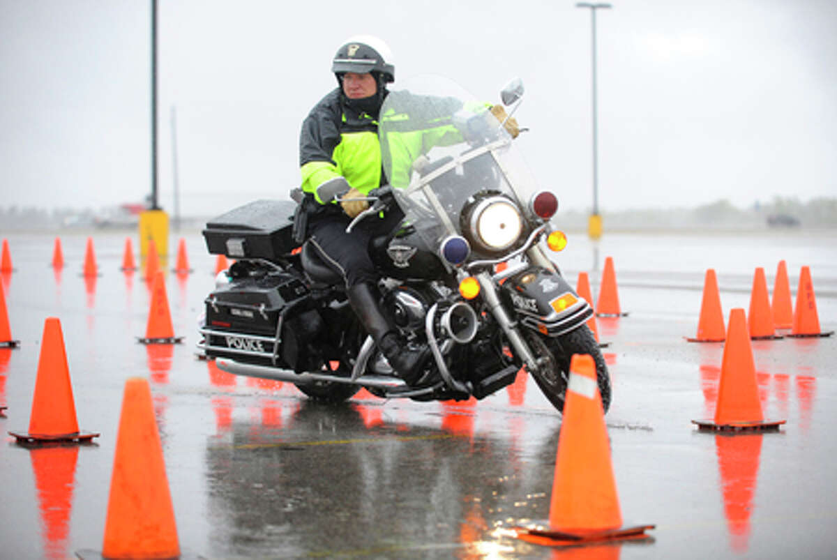 Motorcycle cops brave the weather to show off skills