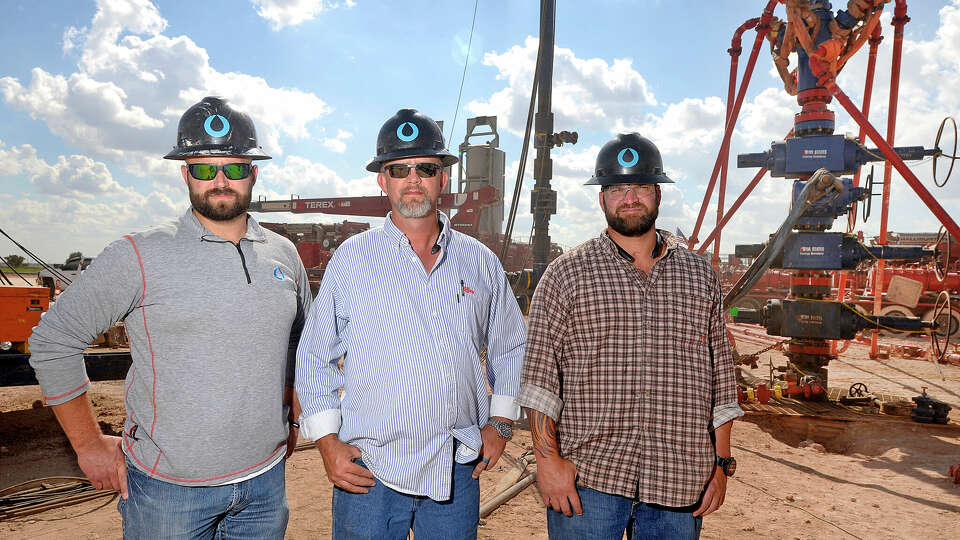 From left, Octane Energy CEO Jared Blong, well-site leader Todd Greer, and well-site leader Justin 'Bull' Smith, in portrait at a fracking site managed by Octane Energy on Friday, Sept. 23, 2016 near Stanton. James Durbin/Reporter-Telegram