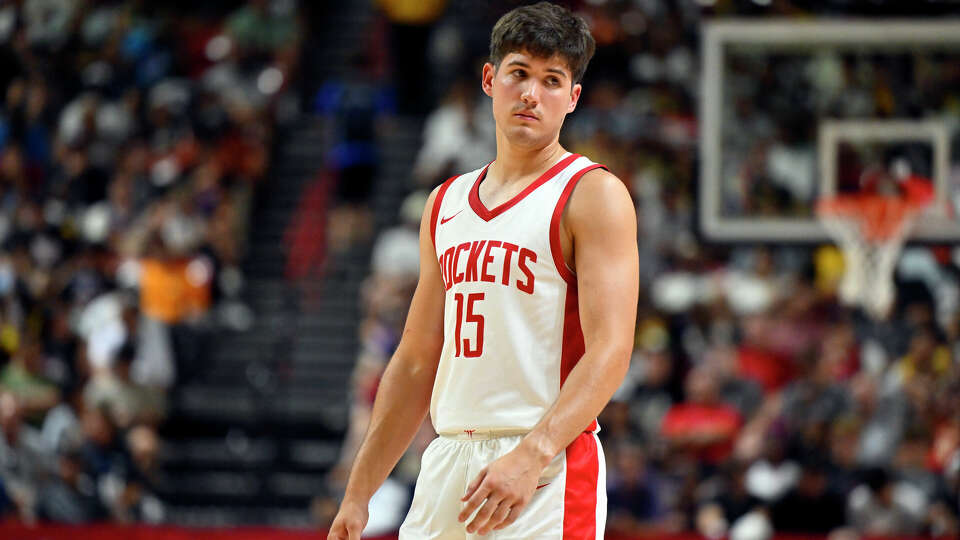 Houston Rockets guard Reed Sheppard (15) looks on during the first half of an NBA summer league basketball game against the Los Angeles Lakers Friday, July 12, 2024, in Las Vegas. (AP Photo/David Becker)