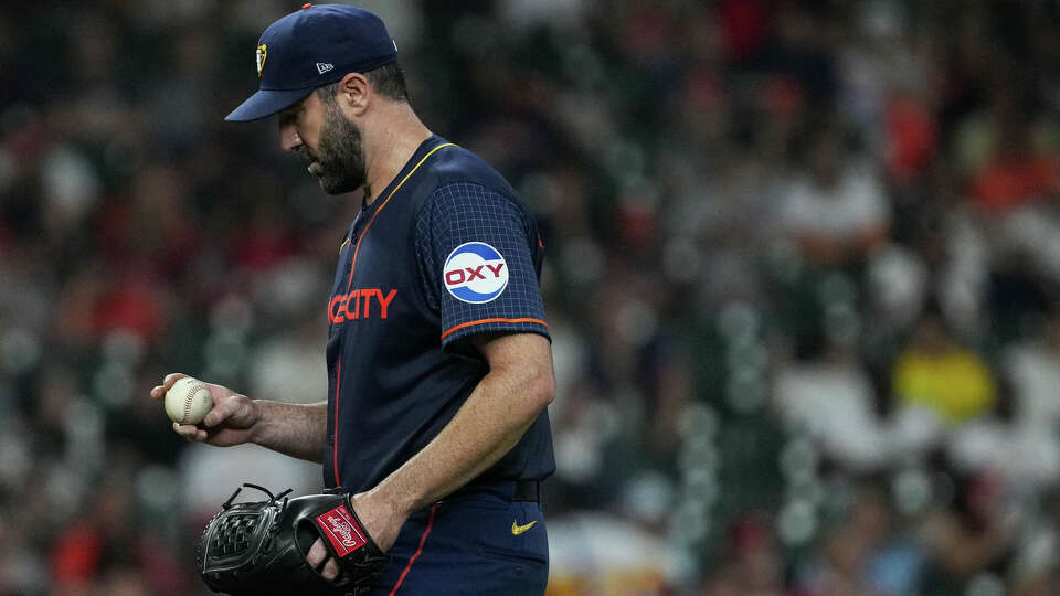 Houston Astros starting pitcher Justin Verlander (35) looks at the baseball in his hand after St. Louis Cardinals second baseman Nolan Gorman (16) hit a solo home run during the fifth inning of an MLB game Monday, June 3, 2024, at Minute Maid Park in Houston.