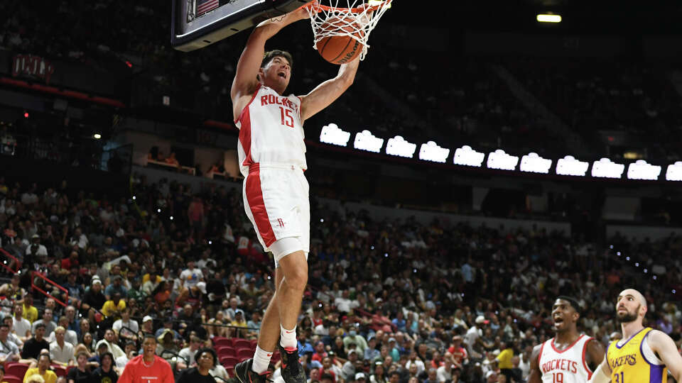 Reed Sheppard #15 of the Houston Rockets dunks against the Los Angeles Lakers in the second half of a 2024 NBA Summer League game at the Thomas & Mack Center on July 12, 2024 in Las Vegas, Nevada. The Rockets defeated the Lakers 99-80. (Photo by Candice Ward/Getty Images)