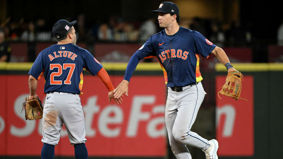 Jose Altuve and Joey Loperfido of the Houston Astros shake hands after the game against the Seattle Mariners at T-Mobile Park on July 20, 2024 in Seattle, Washington. The Houston Astros won 4-2. (Photo by Alika Jenner/Getty Images)