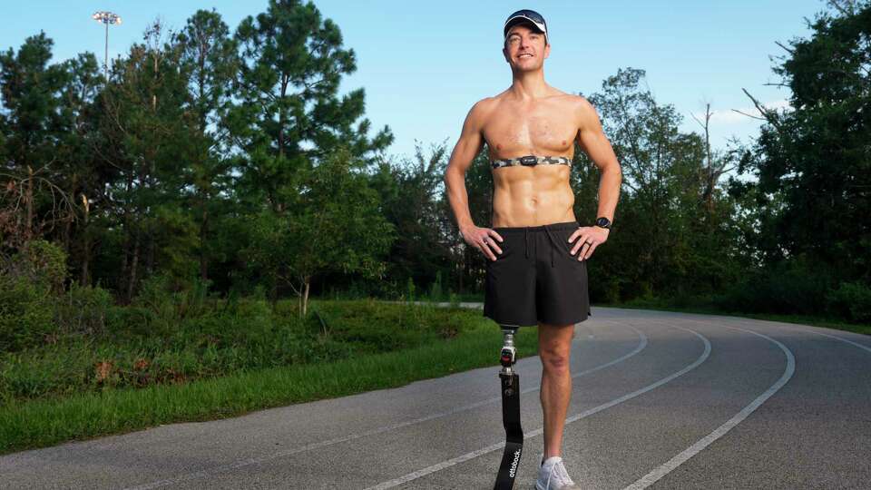 Mark Barr poses for a photograph before his running Sunday, July 21, 2024 at Memorial Park in Houston. Barr is preparing for the Paris Paralympics, in which he competes in the triathlon.