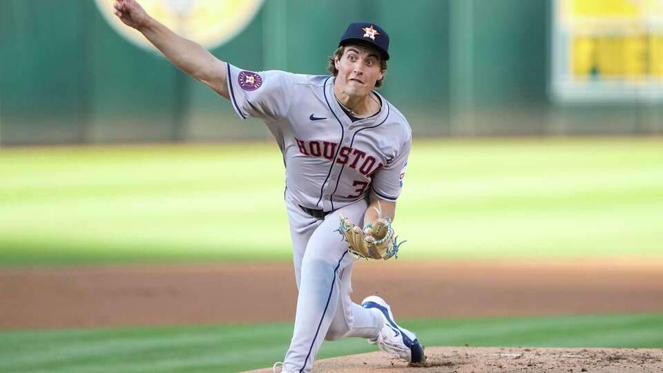 OAKLAND, CALIFORNIA - JULY 23: Jake Bloss #39 of the Houston Astros pitches against the Oakland Athletics in the bottom of the first inning on July 23, 2024 at the Oakland Coliseum in Oakland, California.