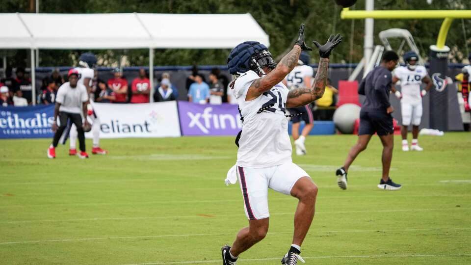 Houston Texans cornerback Derek Stingley Jr. (24) reaches up to make a catch during an NFL training camp Wednesday, July 24, 2024, in Houston.