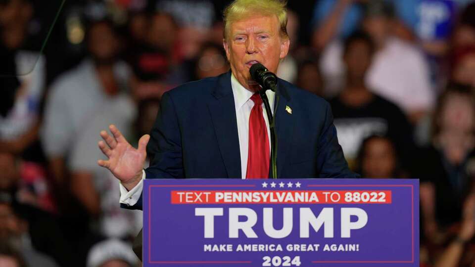 FILE - Republican presidential candidate former President Donald Trump speaks at a campaign rally, June 22, 2024, in Philadelphia. Trump is seeking to distance himself from a plan for a massive overhaul of the federal government drafted by some of his administration officials. Some of these men are expected to take high-level roles if the Republican presumptive nominee is elected back into the White House. Trump is saying on Truth Social that he 'knew nothing about Project 2025.' (AP Photo/Chris Szagola, File)