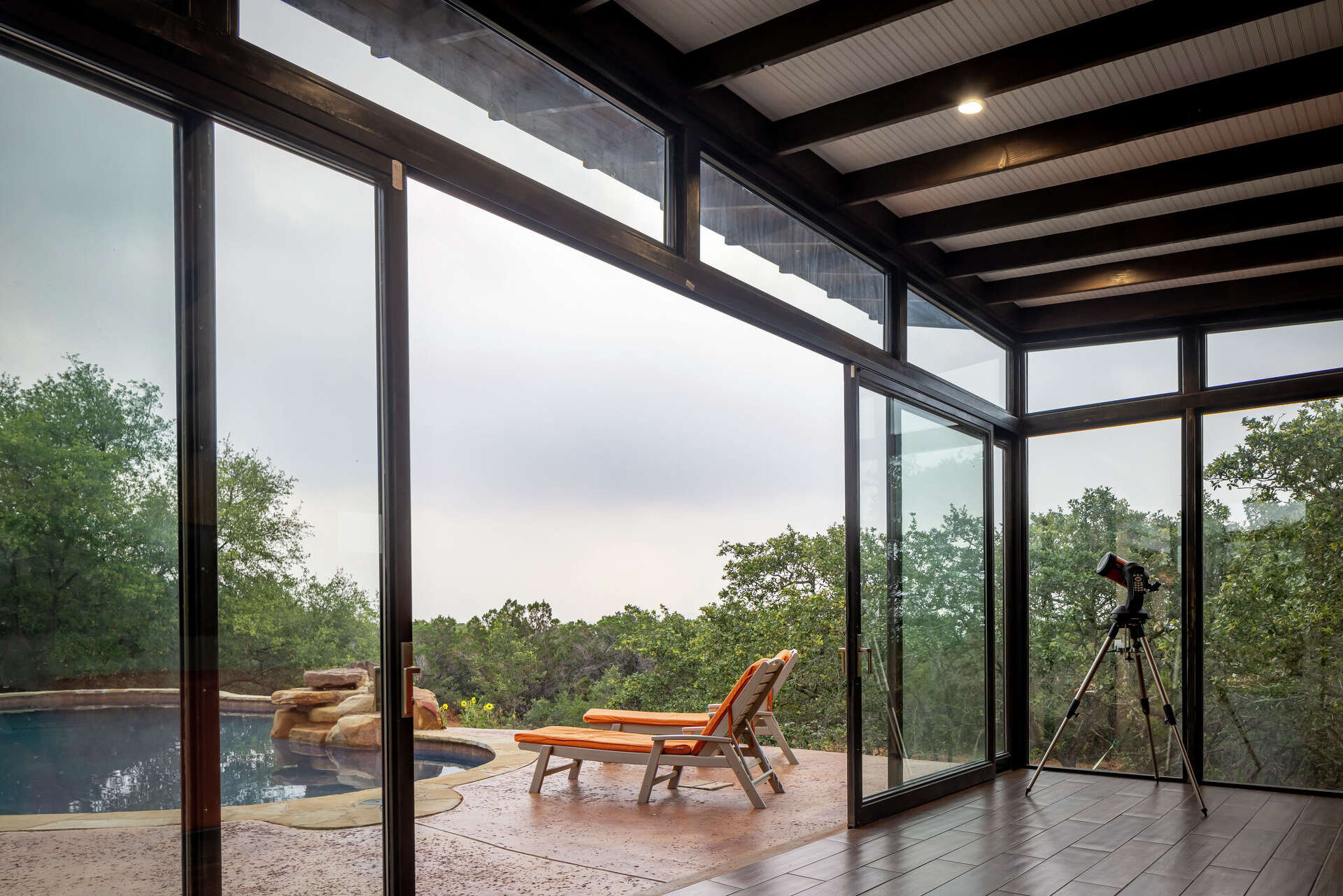 Helotes backyard levels up with modern pool pavilion