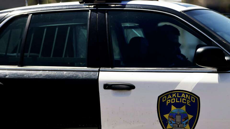 Oakland Police Department car at the scene of an incident in Oakland, Calif., on Thursday, April 11, 2024.