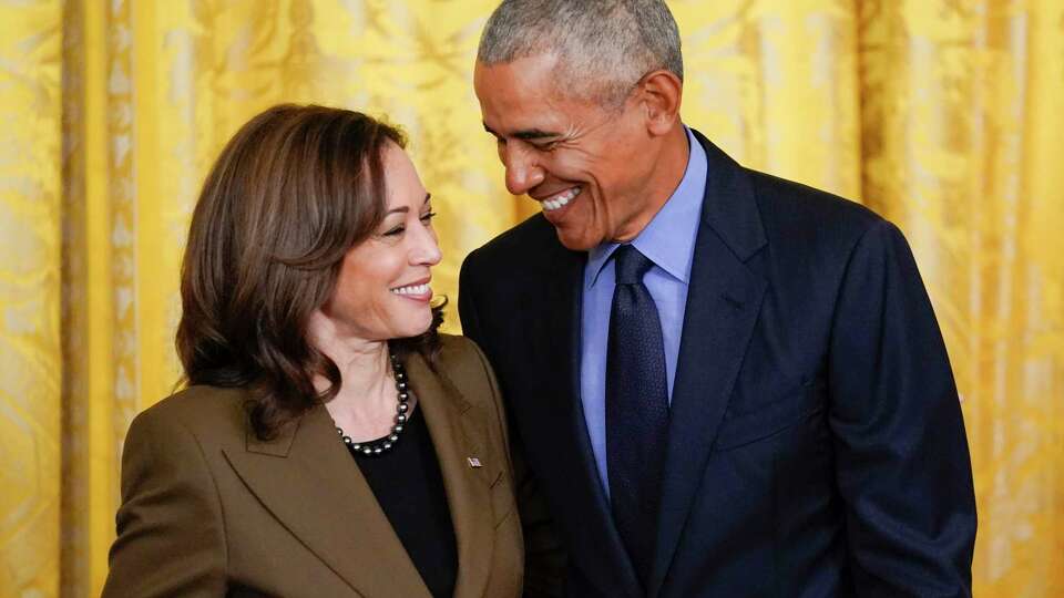 FILE - Former President Barack Obama talks with Vice President Kamala Harris during an event about the Affordable Care Act, in the East Room of the White House in Washington, April 5, 2022. Former President Barack Obama and former first lady Michelle Obama have endorsed Kamala Harris in her White House bid, giving the vice president the expected but still crucial backing of the nation’s two most popular Democrats.