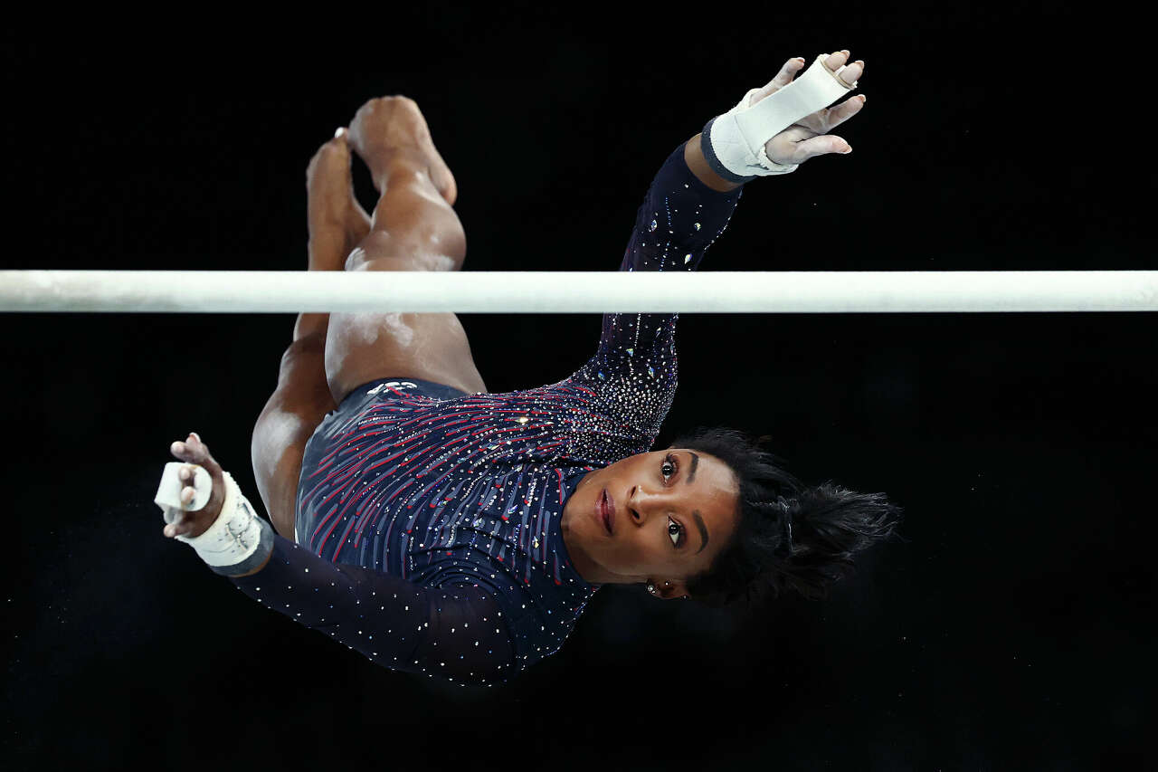 Simone Biles, practicing on uneven bars on Thursday, has applied to have a skill on the event named for her.