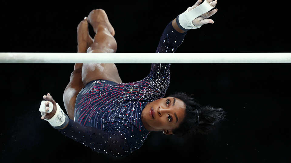 Simone Biles, practicing on uneven bars on Thursday, has applied to have a skill on the event named for her.