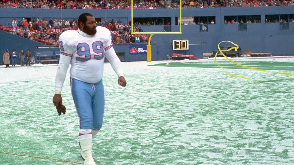 After a big 1989 Oilers win in Pittsburgh, defensive lineman Doug Smith walks off the field at Three Rivers Stadium on December 3, 1989.