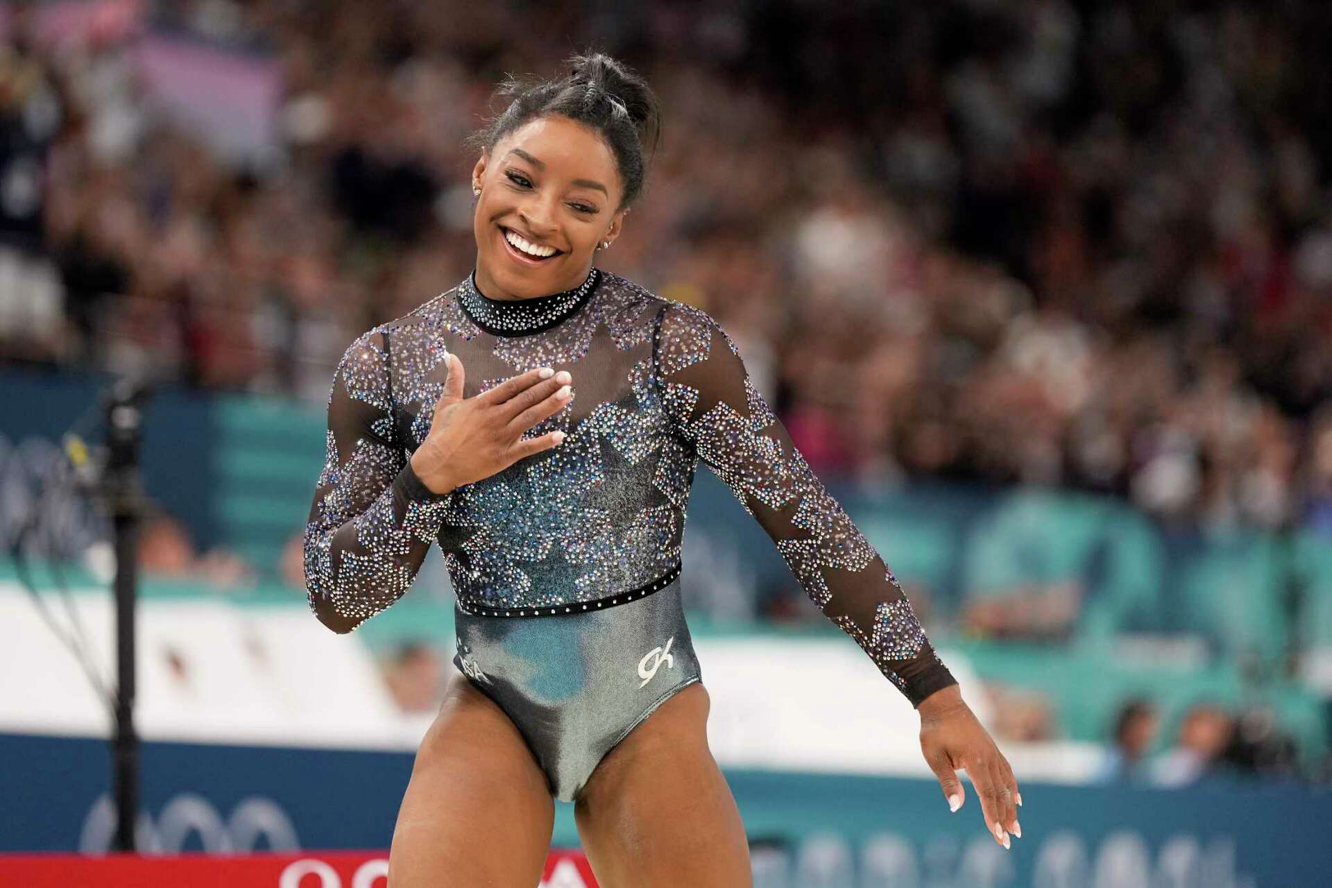 Simone Biles shakes off a calf injury to dominate during Olympic gymnastics  qualifying