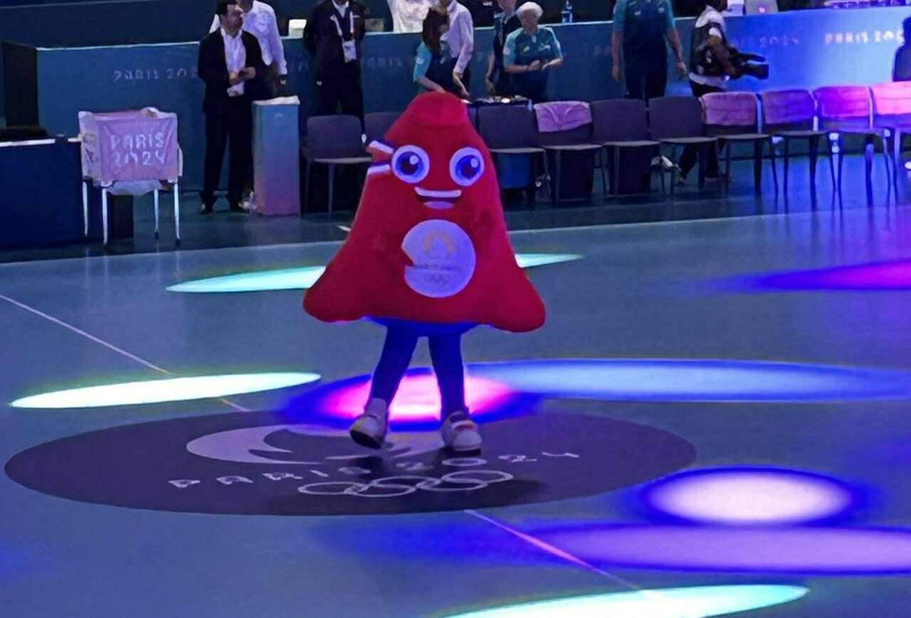 The Paris 2024 mascot, Phryge, dancing to Michael Jackson under disco lights at halftime of the handball game,