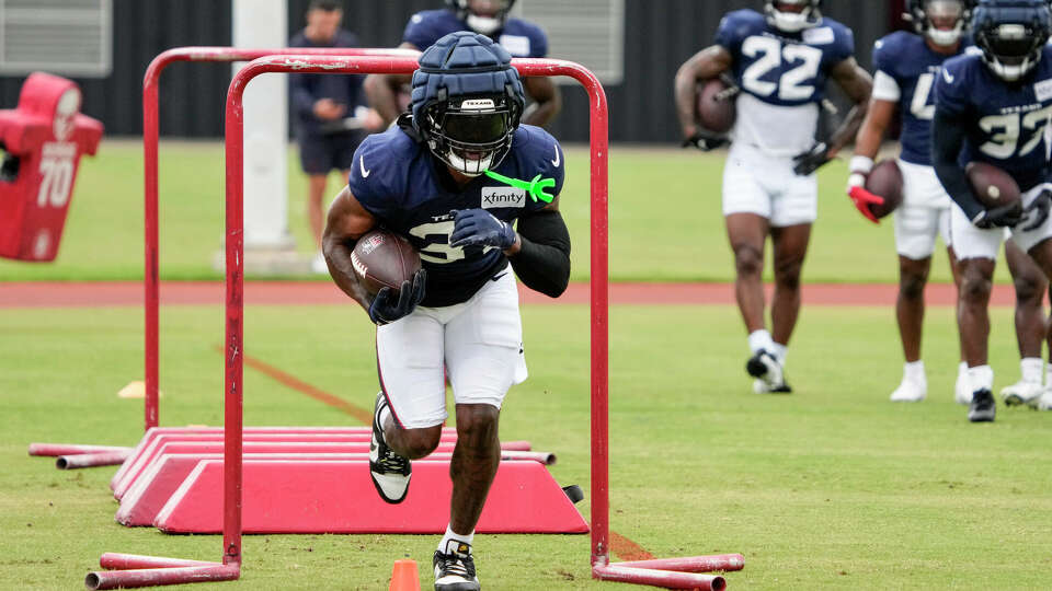 Houston Texans running back Dameon Pierce (31) runs a drill during an NFL training camp Wednesday, July 24, 2024, in Houston.