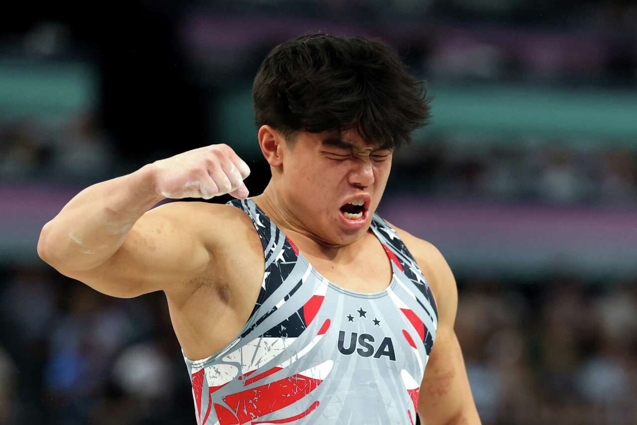 PARIS, FRANCE - JULY 29: Asher Hong of Team United States celebrates after competing on the vault during the Artistic Gymnastics Men's Team Final on day three of the Olympic Games Paris 2024 at Bercy Arena on July 29, 2024 in Paris, France.