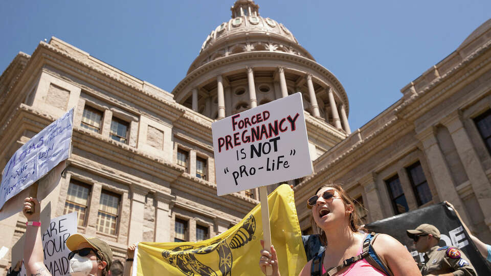 FILE - Claire Fritz rallies for abortion rights at the Capitol, in Austin, Texas, May 14, 2022. A new study released by Johns Hopkins University on Monday, June 24, 2024, shows the infant death rate in Texas went up in the wake of the state's abortion ban. ( Jay Janner/Austin American-Statesman via AP, File)