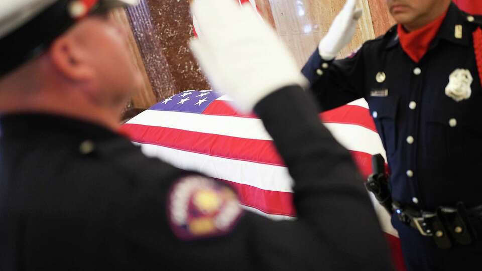 Color board salute as they switch duty watching over the casket of the late Congresswoman Sheila Jackson Lee in the rotunda of Houston City Hall on Monday, July 29, 2024 in Houston.