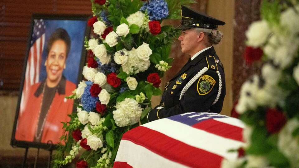 A Houston Police Honor Guard officer stands by the flag-draped coffin of the late Congresswoman Sheila Jackson Lee as she lay in state in the rotunda of Houston City Hall Monday, July 29, 2024, in Houston. Jackson Lee died on July 19 after battling pancreatic cancer.