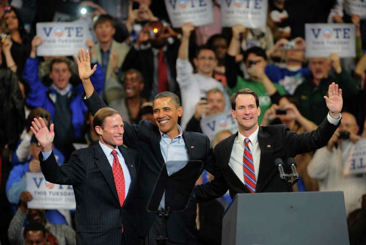President Obama, center, stands with Connecticut Attorney General Richard Blumenthal, left, and US Representative Chris Himes, after Obama spoke at the Arena at Harbor Yard in downtown Bridgeport, Conn. on Saturday October 30, 2010.