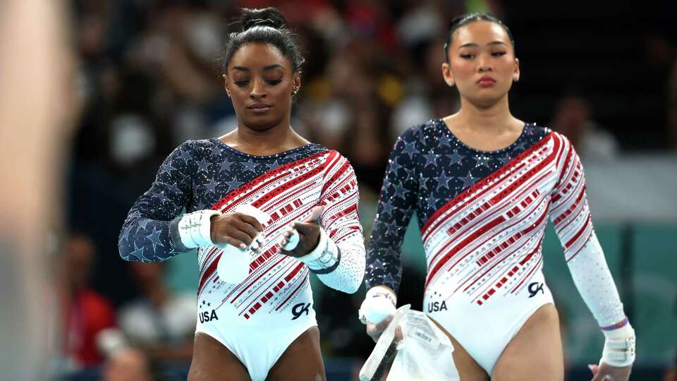 PARIS, FRANCE - JULY 30: Simone Biles and Sunisa Lee of Team United States look on during the Artistic Gymnastics Women's Team Final on day four of the Olympic Games Paris 2024 at Bercy Arena on July 30, 2024 in Paris, France.