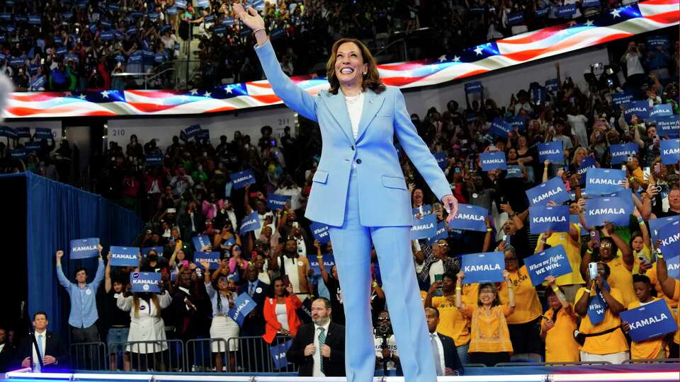 Vice President Kamala Harris waves during a campaign rally, Tuesday, July 30, 2024, in Atlanta.