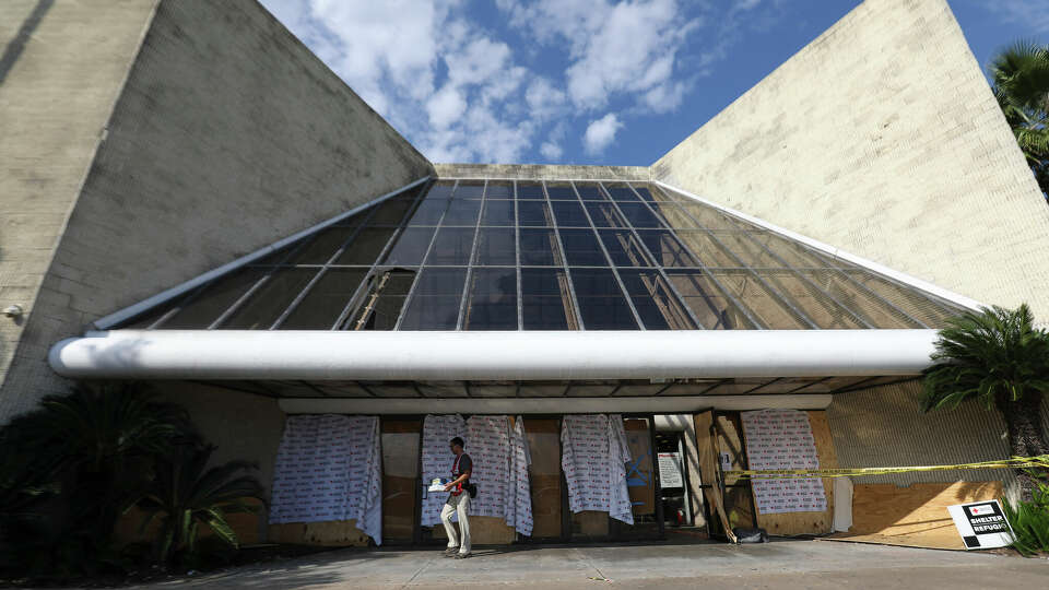 The American Red Cross Shelter Manager Thomas Cundiff puts out containers for cigarette butts outside of a shelter at the vacant Macy's at Greenspoint Mall Sunday, Sept. 24, 2017, in Houston. The transition ended on Saturdya. Red Cross had been transporting Hurricane Harvey evacuees from NRG Center in the past few days and the transition was completed on Saturday. ( Yi-Chin Lee / Houston Chronicle )