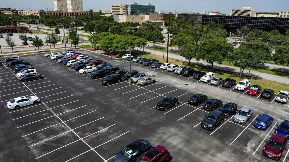 A parking lot on the University of Houston Campus is photographed on Wednesday, July 31, 2024 in Houston. Many students face having to pay for parking in addition to other student fees.