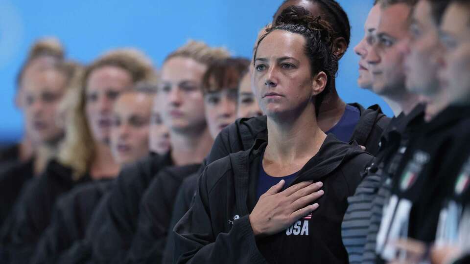 PARIS, FRANCE - JULY 31: Maggie Steffens of Team United States sings the national anthem before the Women's Preliminary Round Group B match between Team Italy and Team United States on day five of the Olympic Games Paris 2024 at Aquatics Centre on July 31, 2024 in Paris, France.