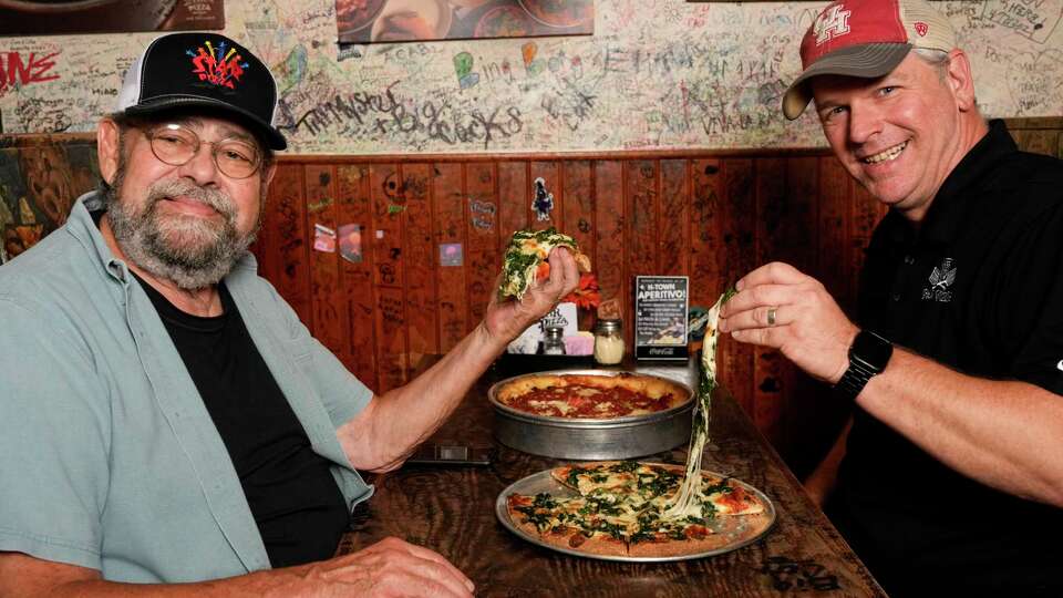 Star Pizza Founder Hank Zwirek, left, and Director of Operations Mike Pittman pose for a photograph Wednesday, July 31, 2024 in Houston.