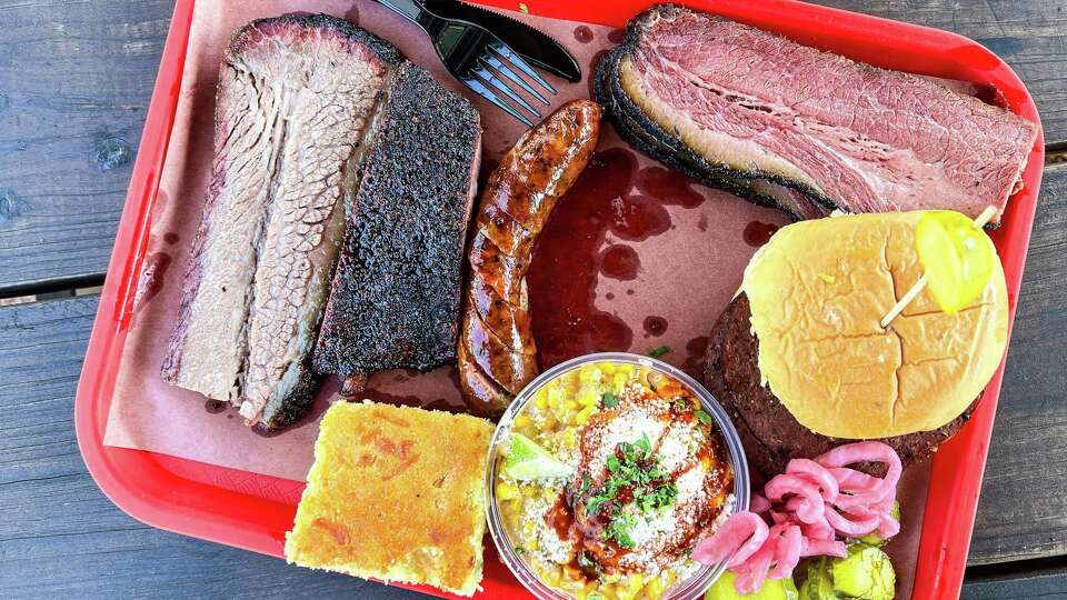 Brisket, pork rib, sausage, pastrami brisket, bologna sandwich, street corn and cornbread at Cattleack BBQ, Farmers Branch