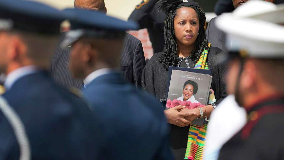 Erica Lee, the daughter of the late Congresswoman Sheila Jackson Lee watches the procession after the casket of her mother was escorted from Fallbrook Church, 12512 Walters Rd., after the Celebration of Life Service Thursday, Aug. 1, 2024, in Houston.