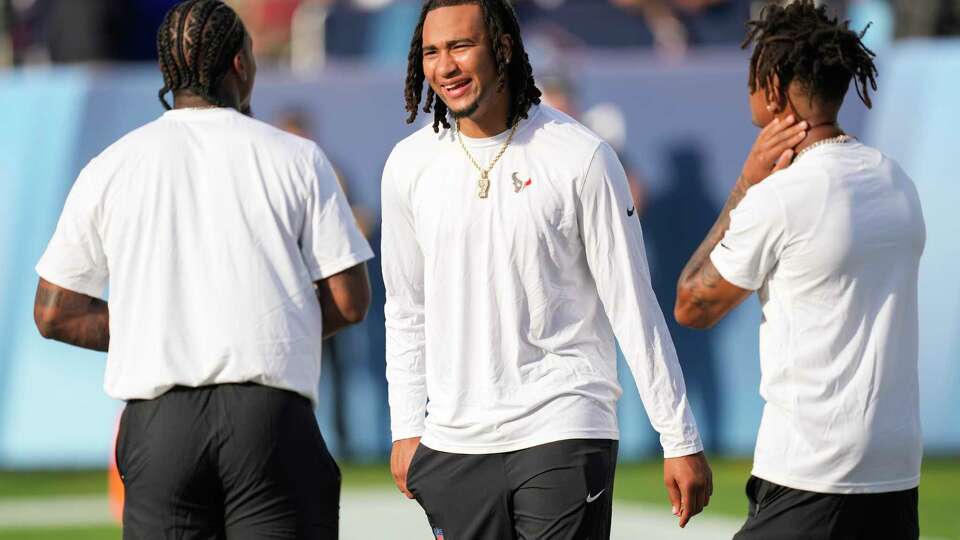 Houston Texans quarterback C.J. Stroud, center, laughs on the field during pre-game warm ups with wide receivers Stefon Diggs, left, Tank Dell before the Hall of Fame Game on Thursday, Aug. 1, 2024 in Canton, Ohio.