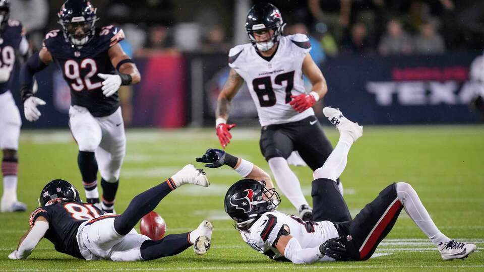 Chicago Bears wide receiver Dante Pettis (81) muffs a punt as he is coved by Houston Texans tight end Cade Stover (87) and linebacker Max Tooley (45) during the second half of the Hall of Fame Game on Thursday, Aug. 1, 2024 in Canton, Ohio.