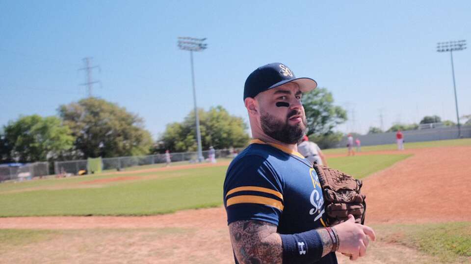 Writer Craig “Hot Body” Hlavaty warms up before a Space City Screwballs game in Spring Branch.