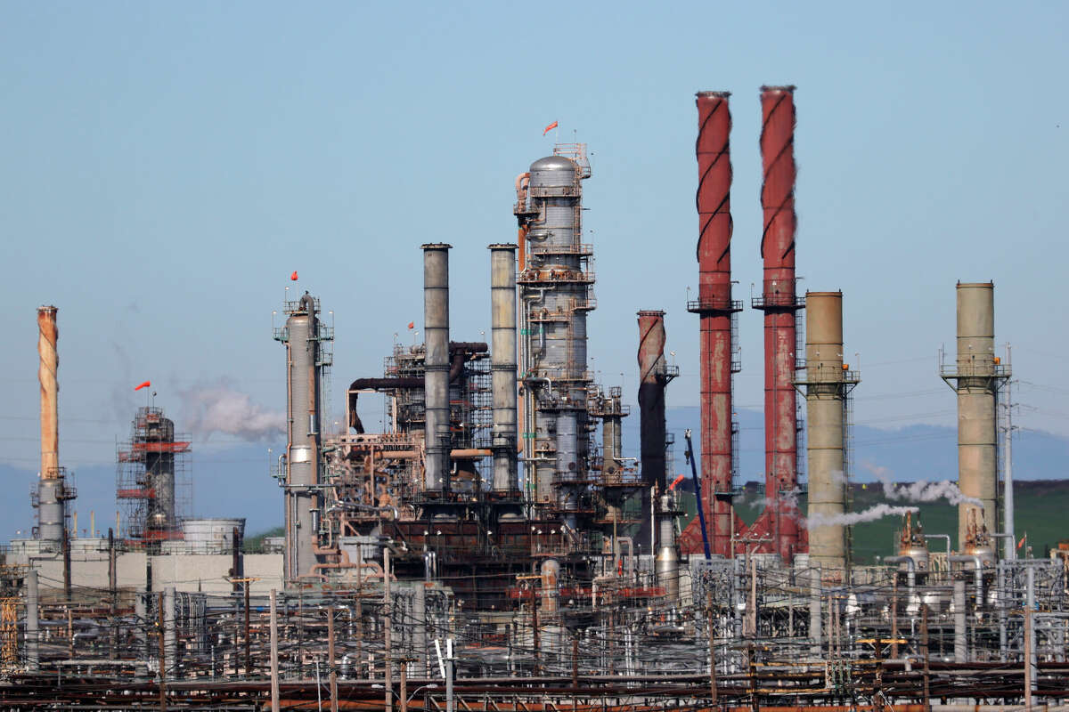 FILE: A view of the Chevron refinery on November 17, 2021 in Richmond, California. One of the company's executives recently complained about a proposed ballot measure in the city that would add $1 of tax per barrel.