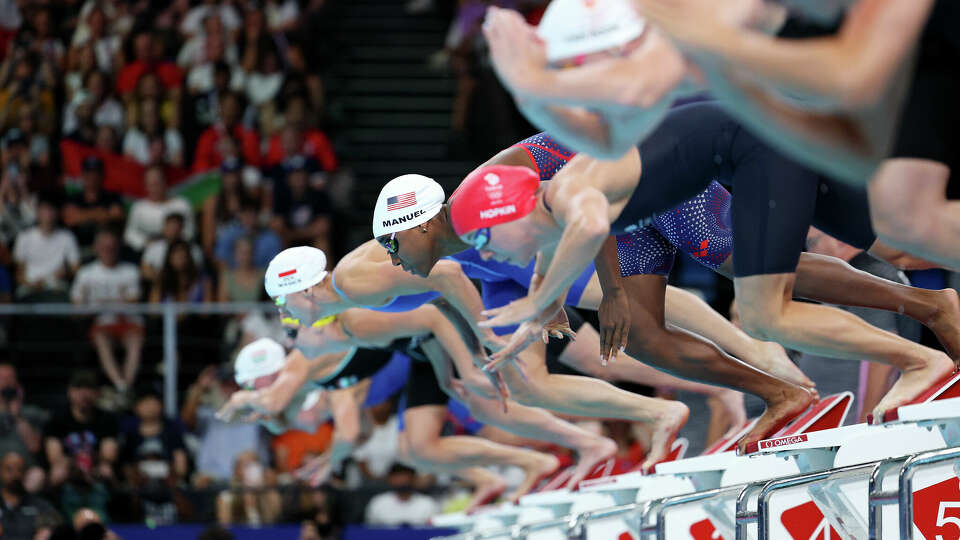 Simone Manuel starts her heat of the 50 freestyle but came up short of advancing.