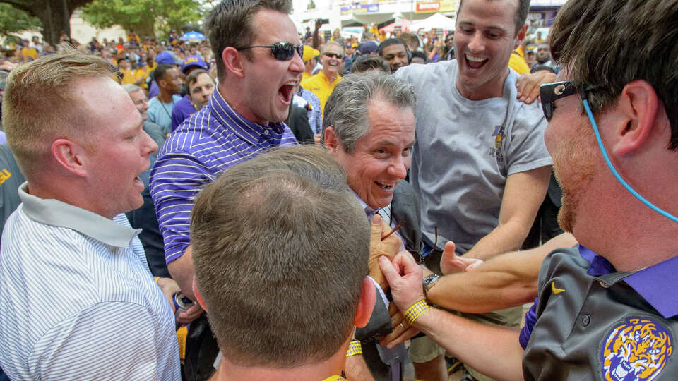 Strength coach Tommy Moffitt, center, pictured with LSU football alumni in 2017, was part of three national championship teams with the Tigers. Texas A&M hopes he brings some of that winning mojo to College Station after being hired this offseason.