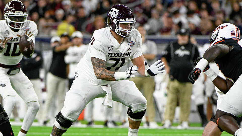 Texas A&M Aggies offensive lineman Chase Bisontis (71) prepares to block during the TaxAct Texas Bowl between the Texas A&M Aggies and Oklahoma State Cowboys at NRG Stadium on December 27, 2023 in Houston, Texas. (Photo by Ken Murray/Icon Sportswire via Getty Images)