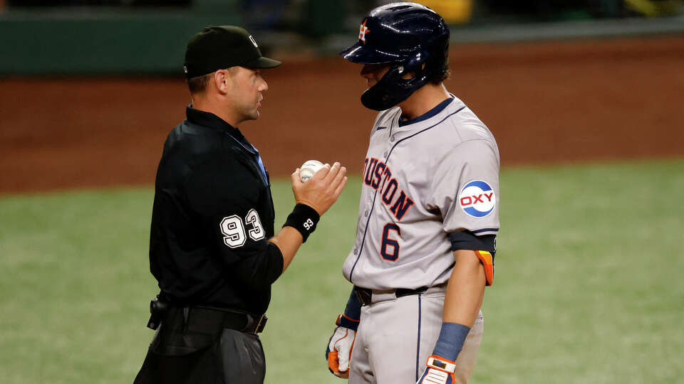 Jake Meyers #6 of the Houston Astros talks with umpire Will Little #93 after a called strike three against the Texas Rangers in the fourth inning at Globe Life Field on August 5, 2024 in Arlington, Texas. (Photo by Ron Jenkins/Getty Images)