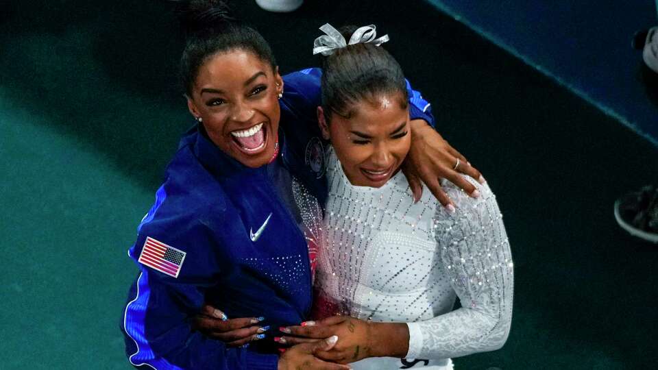 Jordan Chiles, of the United States, and Simone Biles, of the United States, celebrate after the women's artistic gymnastics individual floor finals in Bercy Arena at the 2024 Summer Olympics, Monday, Aug. 5, 2024, in Paris, France. Biles won the silver medal and Chiles the bronze medal. (AP Photo/Morry Gash)