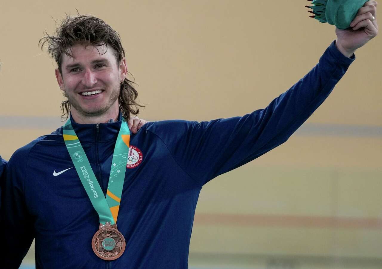 Grant Koontz, celebrating a bronze medal with Colby Lange at the Pan Am Games last fall, says he has pared his life down to living on about $1,200 a month.