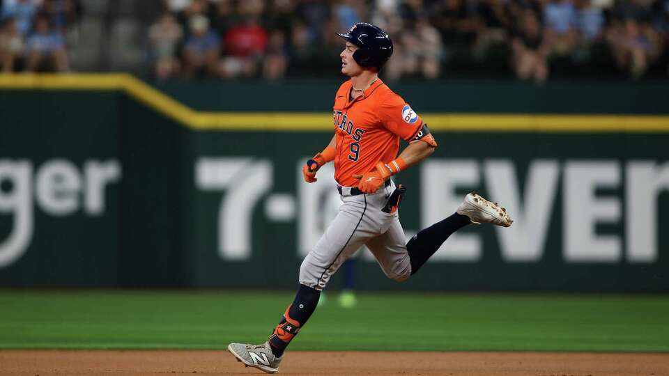 ARLINGTON, TEXAS - AUGUST 07: Zach Dezenzo #9 runs to second base after hitting a double against the Texas Rangers in the second inning at Globe Life Field on August 07, 2024 in Arlington, Texas.